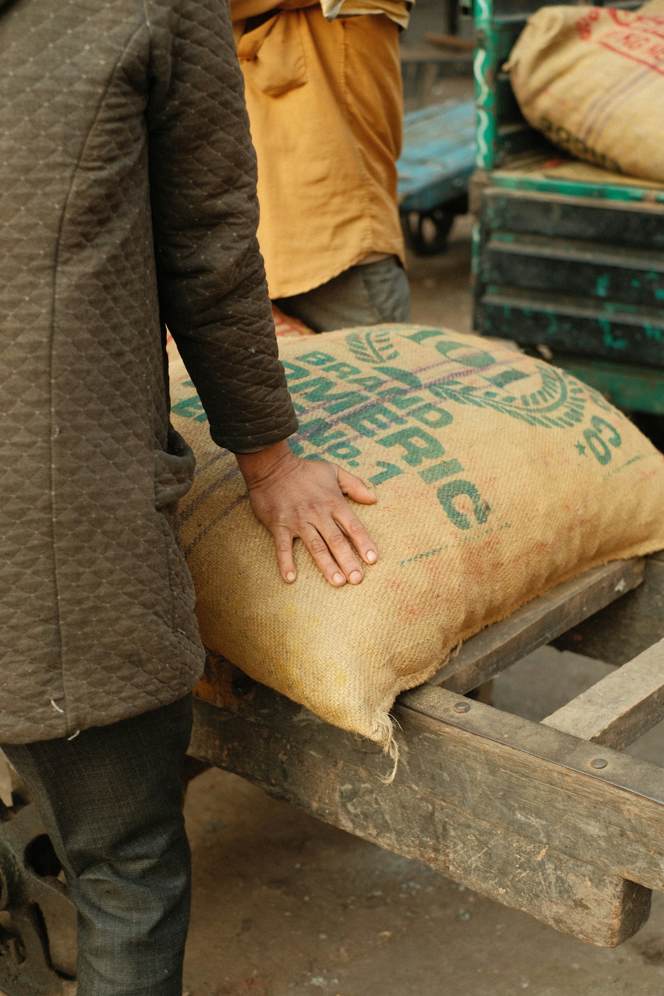 Rotating hero imagery showing trading desks, agricultural goods, controlled growing operations, and industrial production